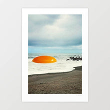 Charger l'image dans la galerie, Beach Egg surreal collage wall art print featuring a giant golden egg yolk resting on a sandy shoreline with waves and rocks, blending food culture with coastal landscapes. Perfect quirky artwork for kitchens, cafes, diners, or beach house interiors. This surreal art print adds playful imagination to modern gallery walls, breakfast nooks, or creative home decor ideas. Ideal for art lovers, surreal collage fans, and anyone searching for unique conversation-starting wall posters.
