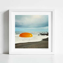 Charger l'image dans la galerie, Explore 'Beach Egg,' a surreal collage artwork blending coastal scenery with whimsical charm. This piece features a giant golden egg yolk on a beach, perfect for art lovers and those intrigued by surrealism. Ideal for modern home decor and beach-themed collections, 'Beach Egg' captures attention with its surreal juxtaposition and imaginative visuals