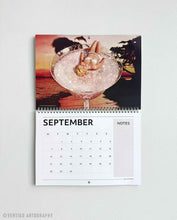 Load image into Gallery viewer, Detailed 2026 monthly calendar with bold surreal collage artwork, perfect for creative living spaces and interior decor.